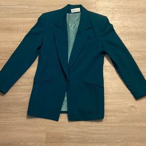 Emerald green women’s blazer, one button, padded shoulders. Size S